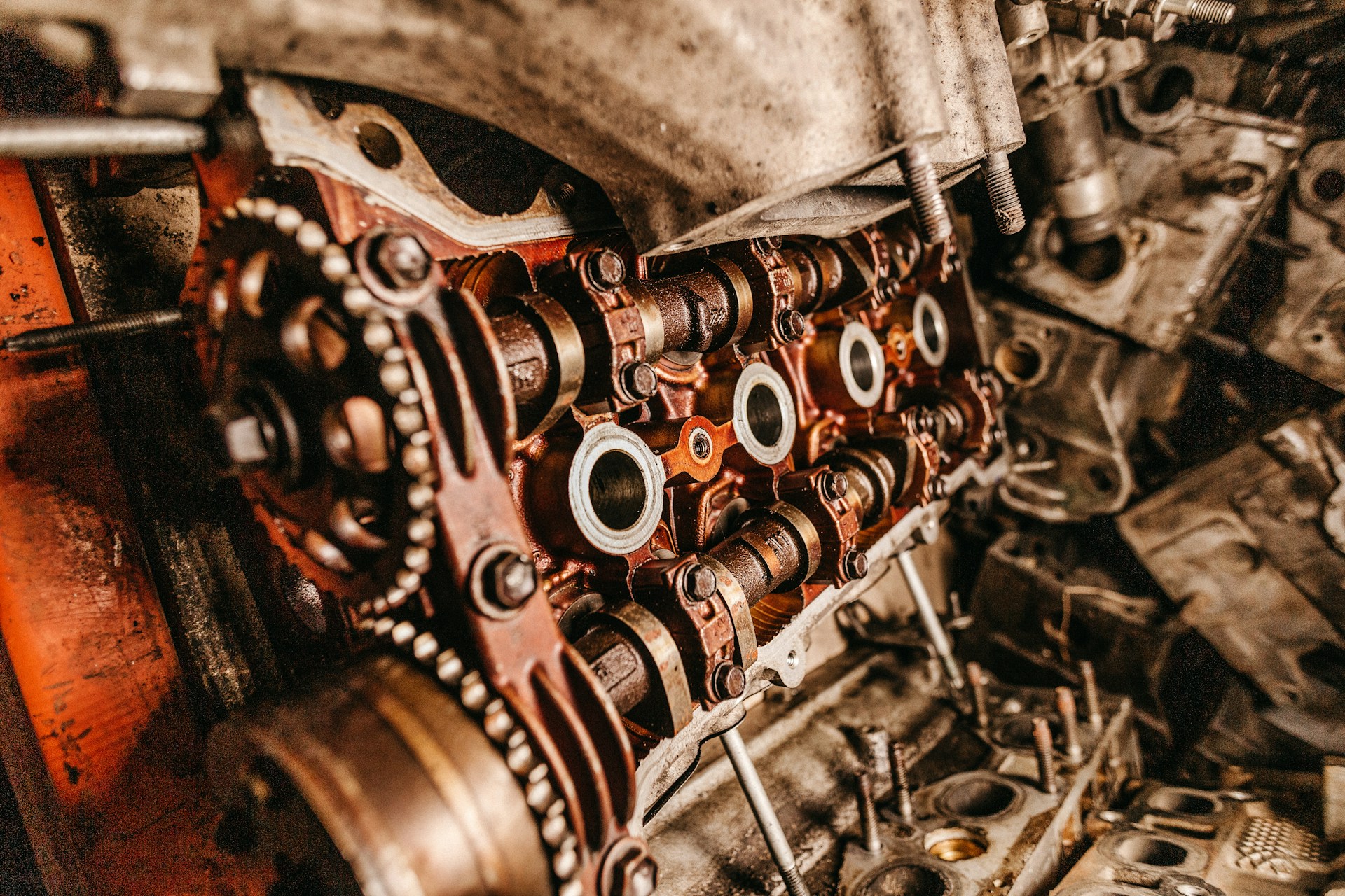 A close-up photo of gears and other machinery. Photo by Jonathan Borba on Unsplash.