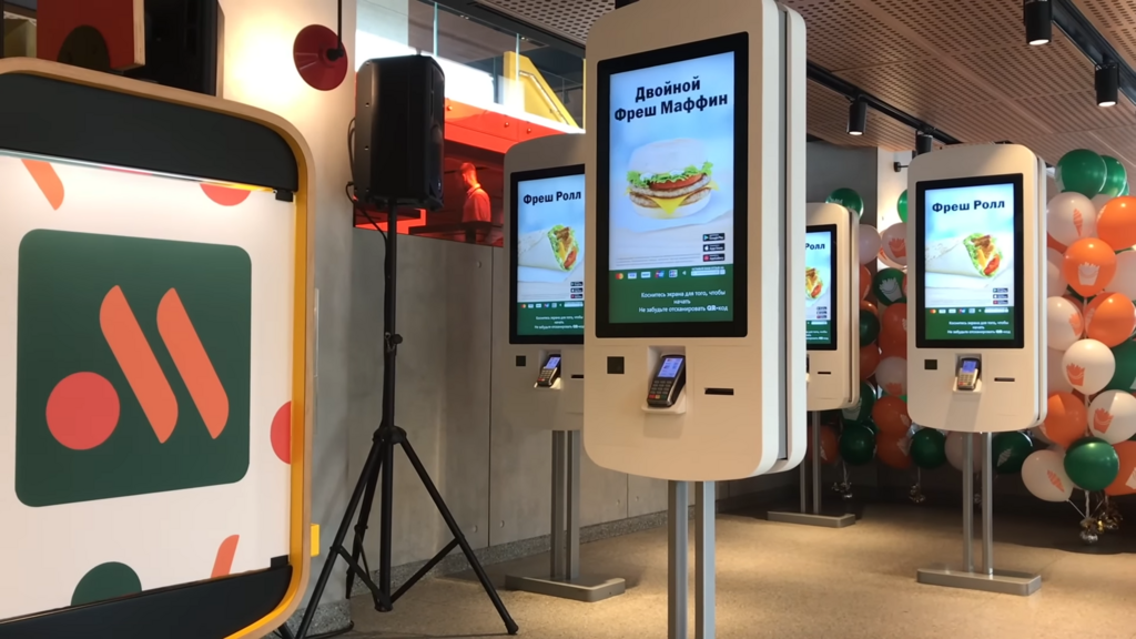 Touchscreen ordering kiosks from Russian fast-food chain Вкусно — и точка.  Photo credit: Wikimedia Commons.