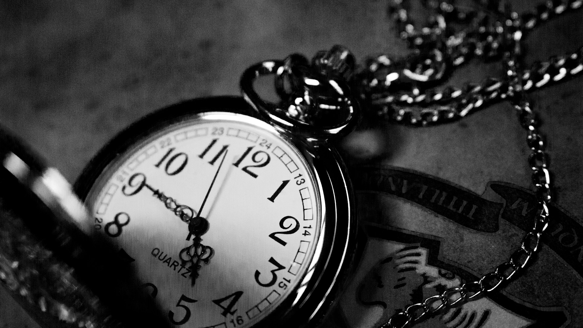 A close-up of a pocketwatch on a chain. Photo by Jiyeon Park on Unsplash.