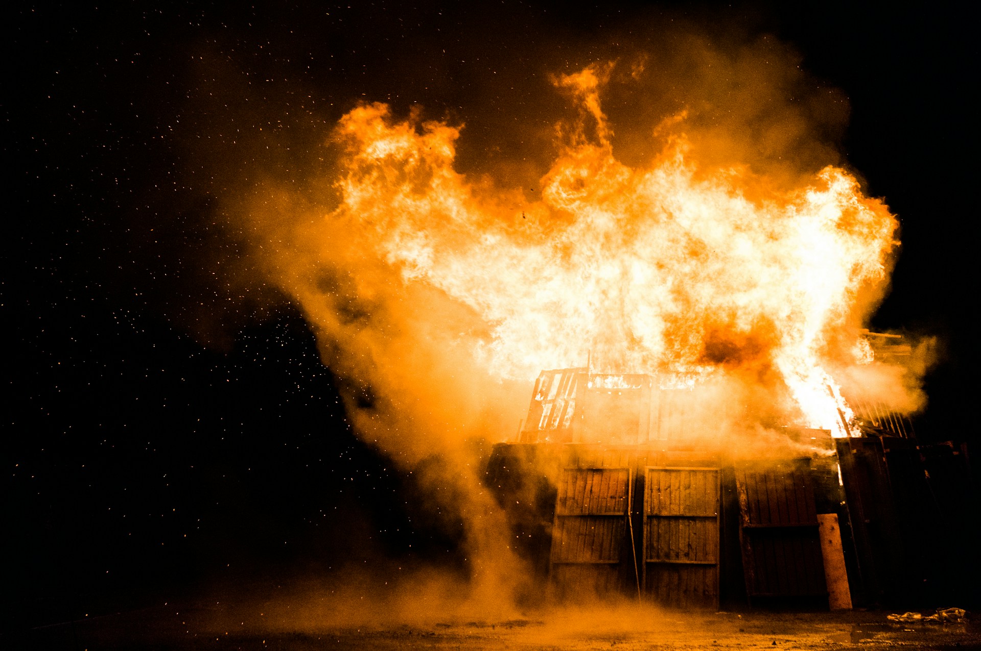 A dumpster, on fire.  Photo by Stephen Radford on Unsplash.